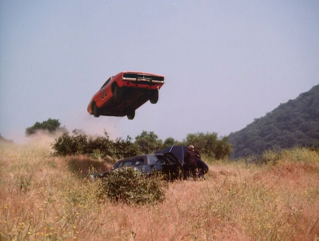 Uncle Jesse never loved the door-less entry of the General. This particular car had no roll bar installed simply so he could escape more easily (kind of). Image: Warner Bros